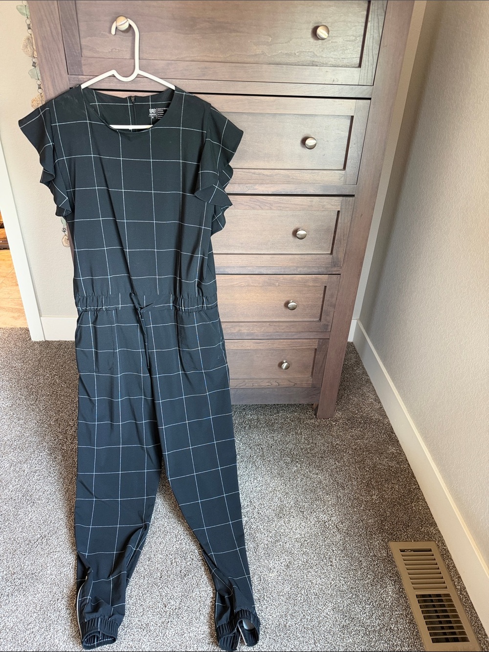 Albion Windowpane Print Black Jumpsuit with Ruffle Sleeves and Ankle Zippers